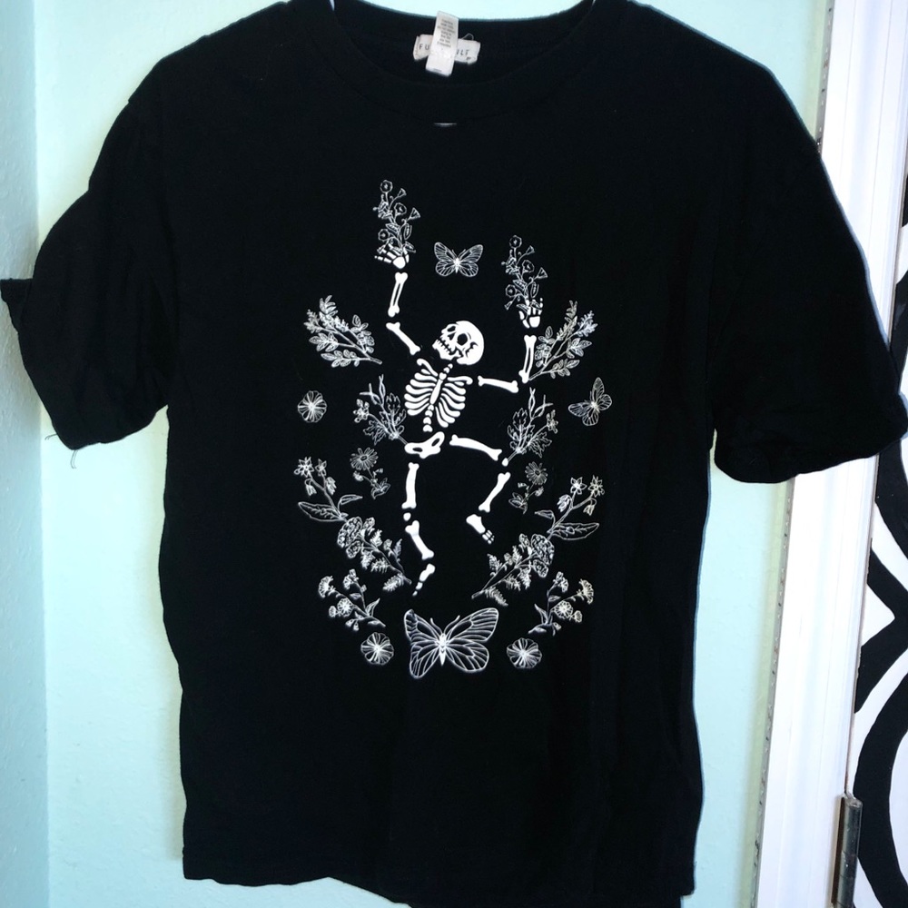 Skeleton frolicking and flowers